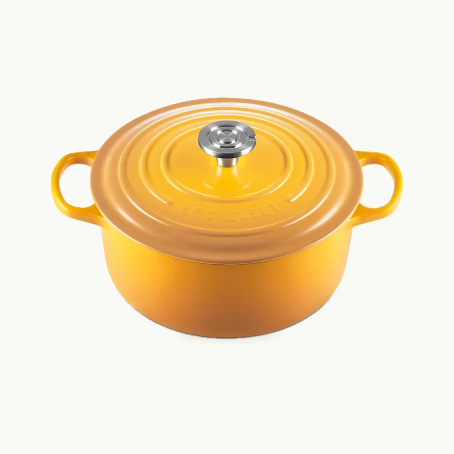 Signature Round Dutch Oven (5.5qt): Nectar yellow Le Creuset Signature Round 5.5-quart Dutch Oven shown with its lid at a three-quarter angle