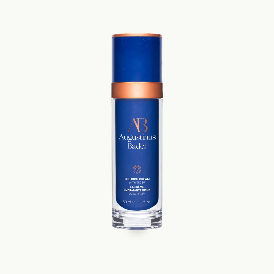 The Rich Cream (50ml): Navy glass bottle of The Rich Cream with a silver pump