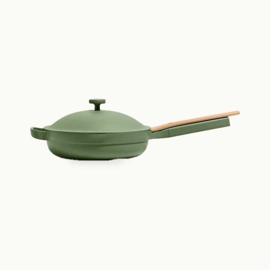 Always Pan 2.0: Sage green Always Pan with its wooden spatula resting on the handle
