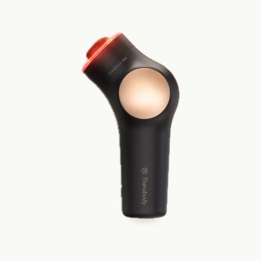 TheraFace PRO: Black TheraFace PRO with a lit treatment head